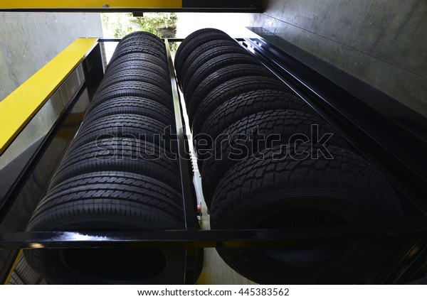 Top view of car tires at\
warehouse .
