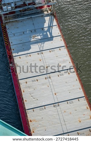 Top view of cargo ship deck with metal hatches