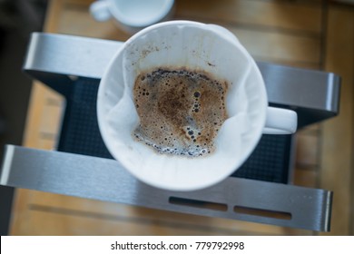 Top View Of Ceramic Dripper Placed On A Stand ,  Making Drip Coffee From The Top View