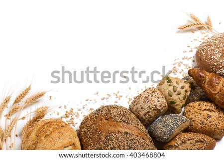 Top view of cereal bread, ears of wheat and different seeds isolated on white background.