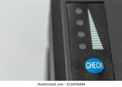 Top View Of Check Button, Level Pyramid And Charge Level Indicator LEDs On Battery. Control Button In Selective Focus. Charge Level Indicator LEDs Do Not Light Up. Free Text Space On The Left.