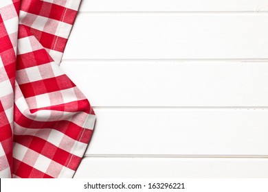 Top View Of Checkered Napkin On White Wooden Table