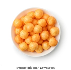 Top view of cheese puff balls in bowl isolated on white