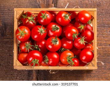Top View Of Cherry Tomatoes In Small Wooden Crate