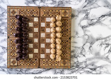 Top View Of A Chess Game On Alabaster Stone Table