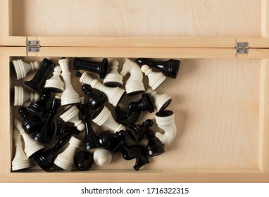 Top View Of Chess Set In The Wooden Box.White And Black Figures Of Chess