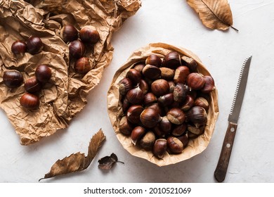 Top view of chestnuts on delicate background 