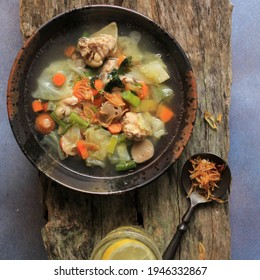 Top View Chicken And Meatball Soup With Carrot And Potato (Sop Ayam Bakso), Daily Indonesian Kids Menu. Copy Space For Text