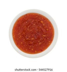 Top View Of Chili Chicken Hot Sauce In A Small Bowl Isolated On A White Background.