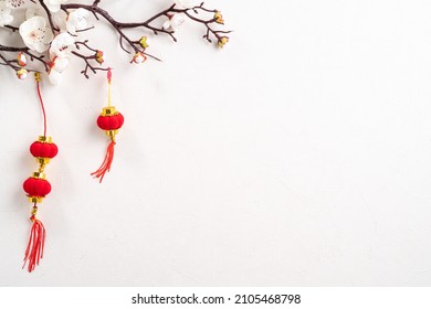 Top view of Chinese lunar new year background copy space design concept with white plum flower and festive decoration, the word inside picture means blessing. - Powered by Shutterstock