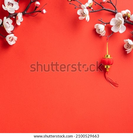 Top view of Chinese lunar new year background copy space design concept with white plum blossom and festive decoration, the word inside picture means blessing.