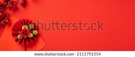 Top view of Chinese lunar new year background copy space design concept with festive decoration, the word inside picture means blessing.