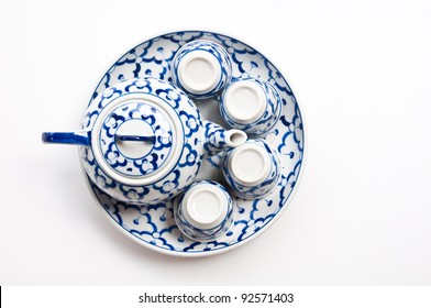 Top View Of Chinese Tea Pot And Cups Isolated On White Background