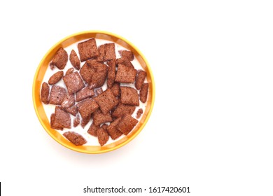 Top view chocolate cereals with milk in yellow bowl - Powered by Shutterstock