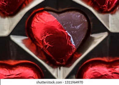 Top View Of Chocolate Heart Candies On Box