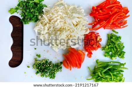 A top view of Chopped vegetables on white chopper