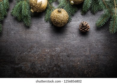 Top Of View Christmas Balls Fir Tree Pine Cones On Free Concrete Background.