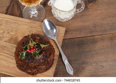 Top View Christmas Brandy Pudding With Holly