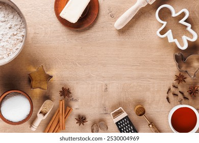 Top view of the Christmas culinary background. Ingredients for baking cookies:flour, rolling pin, spices, sugar, honey, butter, ginger, cookie cutter. Baking holiday cookies with a place for text - Powered by Shutterstock