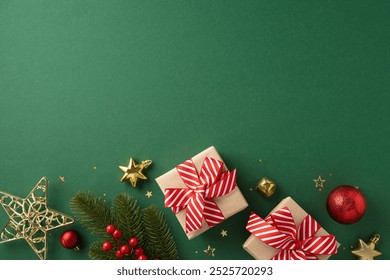 Top view of Christmas gifts with red bows, ornaments, and fir branches on a green backdrop setting - Powered by Shutterstock