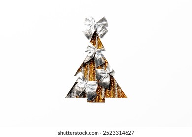 Top view of a Christmas tree shape cutout filled with gold tinsel and decorated with silver bows, on a white background. Suitable for creating holiday cards, designs, and decorations, with space for t - Powered by Shutterstock