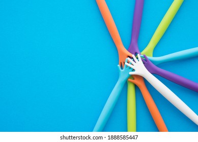Top view circle stack pile of people putting hands on blue background copy space. Teamwork, collaborate and unity in business finance concept. Teamwork is leadership strategy and business management.