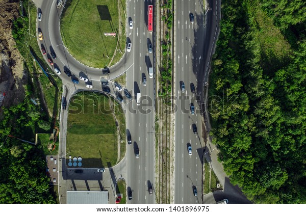 Top view of city car traffic on roads,\
aerial drone photo of urban\
transportation.