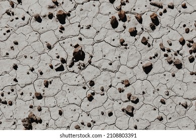 A top view of the clacked stone ground with pebbles