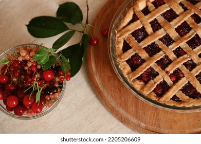 Top View Of Classic American Festive Cherry Pie With Crispy Sweet Pastry Lattice And Fresh Ripe Organic Berries In Bowl. Homemade Berry Cake With Flaky Crust. Thanksgiving Concept. Bakery Products