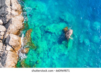 Top view of the cliffs and the blue sea - Shutterstock ID 660969871