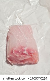 Top View, Close Distance, Of Freshly Caught, Black Gropper Fish Fillet, On Plastic And Butcher Paper