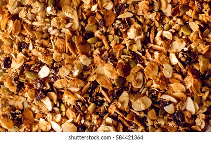 Top view close up photo image on muesli pile, abstract cereal grain pattern, granola texture as background, overlay for art work