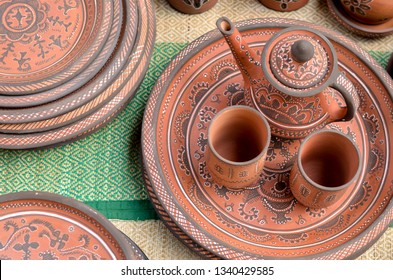 Top View Closeup Beautiful Gujarati Khavda Pottery Earthen Terracotta Crockery Tea Cups Kettle & Tray In Roadside Market Exhibition Stall, Dilli Haat, New Delhi Incredible India 