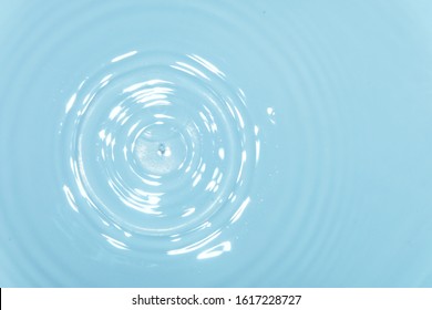 top view Closeup blue water rings, clear water, Close-up water droplets affect the surface, forming rings on the surface. reflections in blue water.