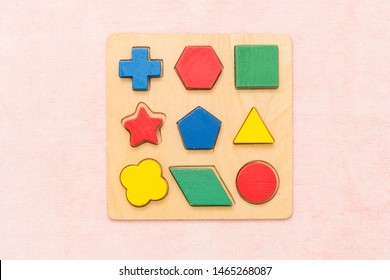 Top View Closeup Of Colorful Wooden Montessori Sensorial Material Learning, Shape And Color Block. Kindergarten Educational Toys, Thinking Process, Cognitive Skills, Learn Through Play Tools Concept.