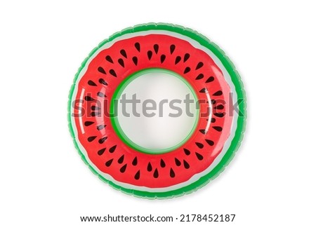 Top view closeup isolated studio shot of colorful red and green watermelon with black seeds round shape swimming pool lifesaver kid rubber ring using on sea beach vacation placed on white background.