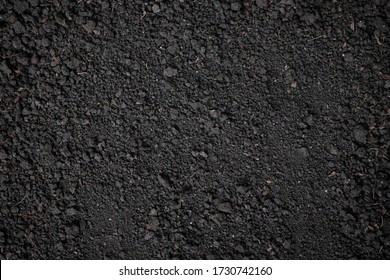 Top View, Close-up Of Organic Black Soil Texture Pattern Background. Can Be Used Planting Tree. Surface Has Grunge And Rough. Feature Of Compost Fertile Suitable For Gardening And Agriculture Farm.