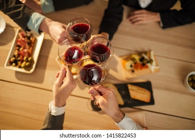 Top View Closeup Of Unrecognizable Tourists Clinking Wine Glasses During Vineyard Tour, Copy Space