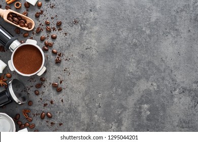 Top view of coffee background. Assorted coffee beans, ground coffee, portafilter and tamper on dark concrete background. Flat lay. Copy space for text. Barista concept. - Powered by Shutterstock