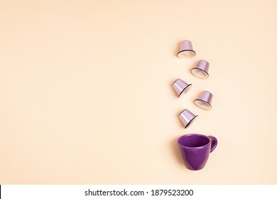 Top View Of Coffee Capsules And Cup Over Beige Background With Copy Space. Morning Dose Of Caffeine, Energy, Flavor Concept. Mockup, Flat Lay