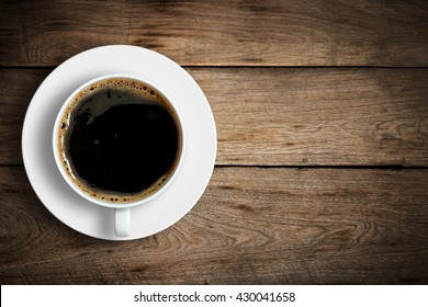 Top View Of Coffee Cup On A Wood Background With Copy Space.