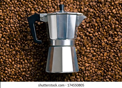 top view of coffee maker on coffee beans