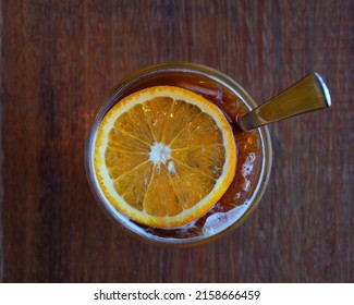 Top View Of Coffee Mix With Orange Juice And Cold Brew Fusion Coffee On The Wooden Table In Cafe, Focus One Point