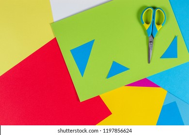 Top View Of Colored Paper With Colorful Scissors. Kids Art And Craft Paper Applique Background