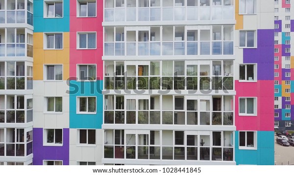 Top\
view of colored residential complex. Clip. Beautiful stylish houses\
of different colors in a luxury residential\
complex
