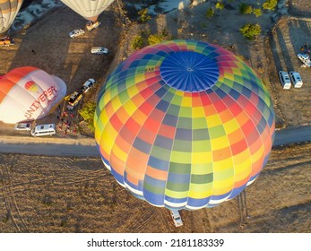 Top View Of Colorful Hot Air Balloons Flying Over The Valley On Sunrise. Aerial View Of A Hot Air Balloon. Cappadocia, Nevsehir, Turkey - July 07, 2014. Selective Focus. 