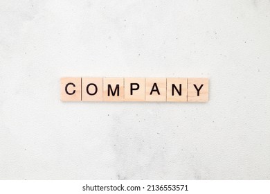Top view of Company word on wooden cube letter block on white background. Business concept