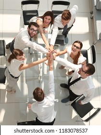 Top View.the Company's Employees Are Giving Each Other High Five