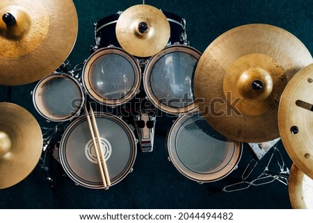 Top view complete drum set. Drumsticks on snare drum.