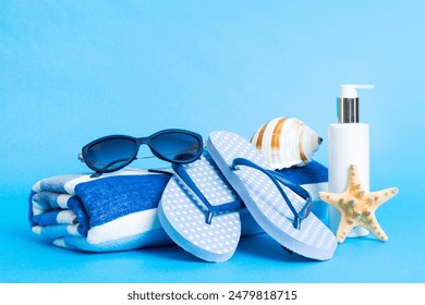 Top view composition of flip flops placed with beach accessories perspective view on table background. Tropical summer vacation concept Flat lay. - Powered by Shutterstock